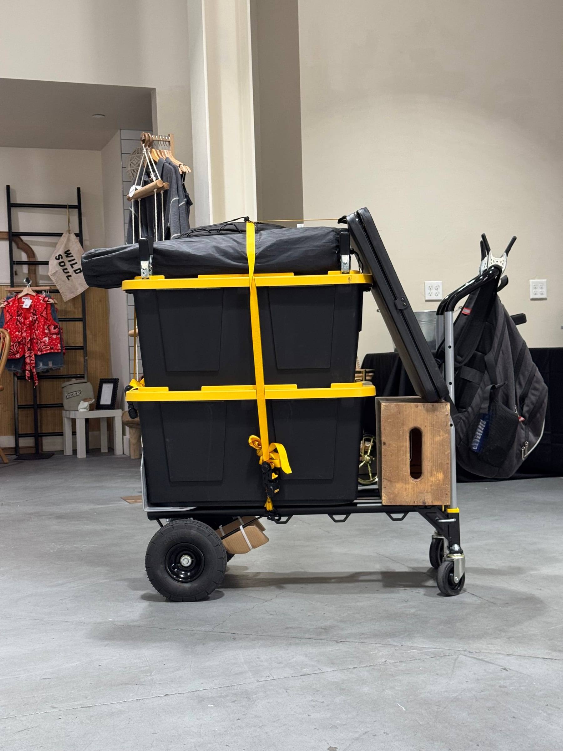 The full kit packed into cases and strapped to a single hand truck