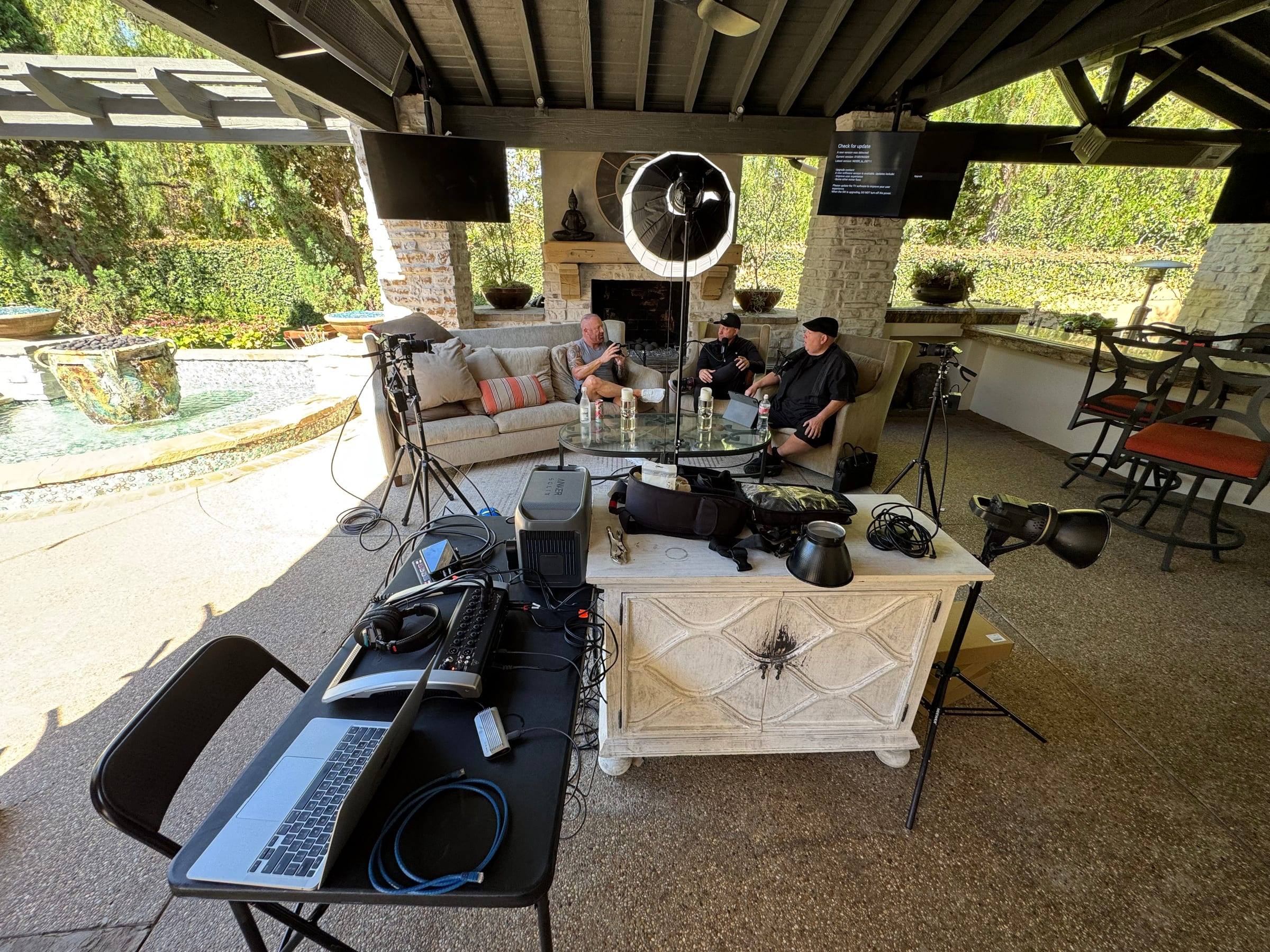 The engineering station on a patio shoot, with laptop, mixer and monitors beside the set