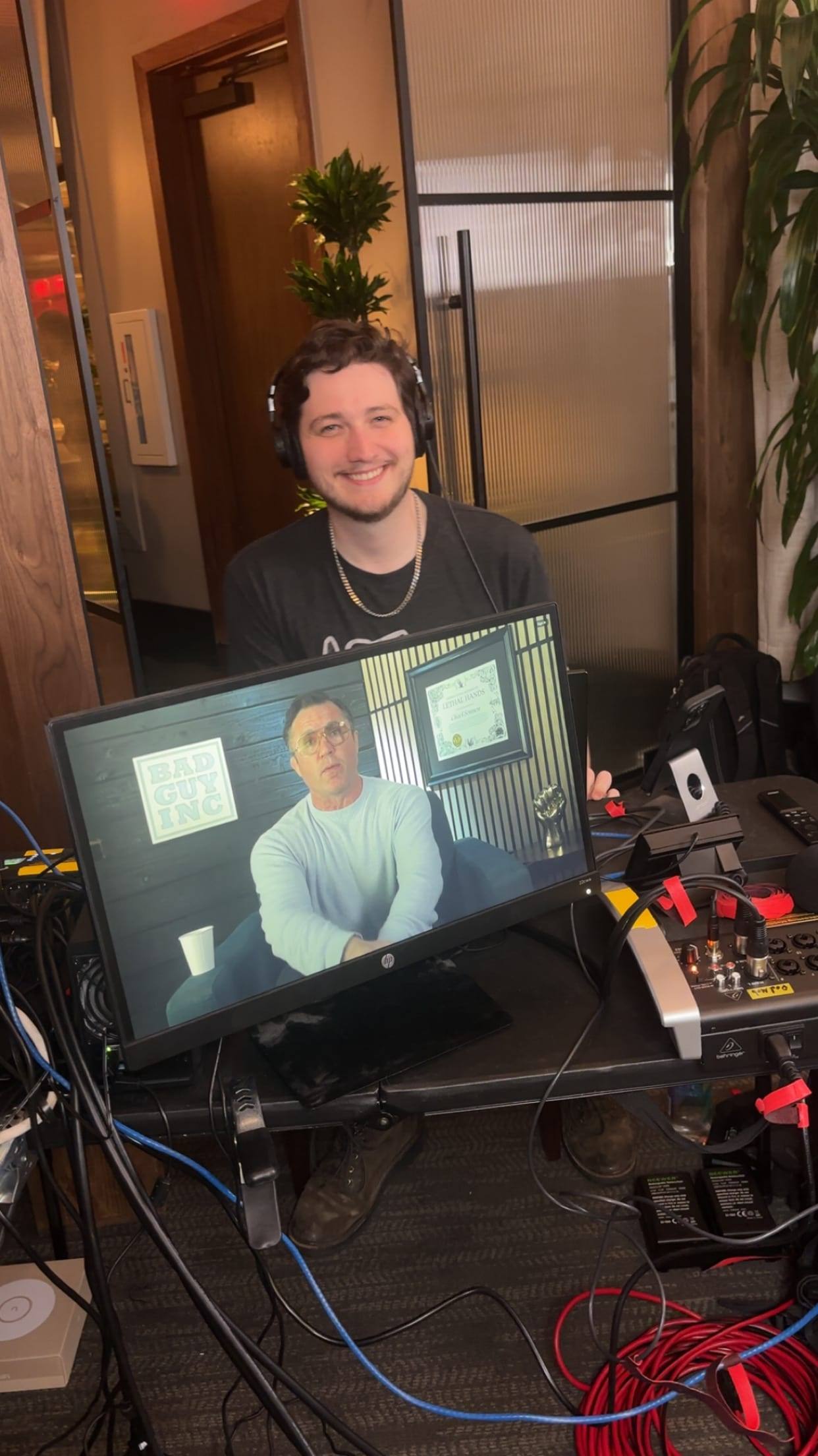 A remote guest on a monitor during an on-location recording